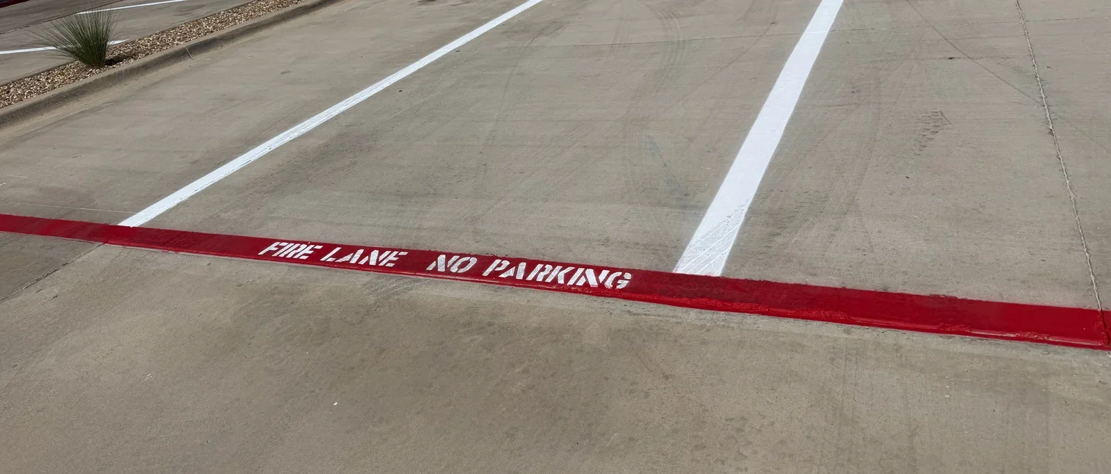 After striping · Entrance stalls and fire-lane lettering