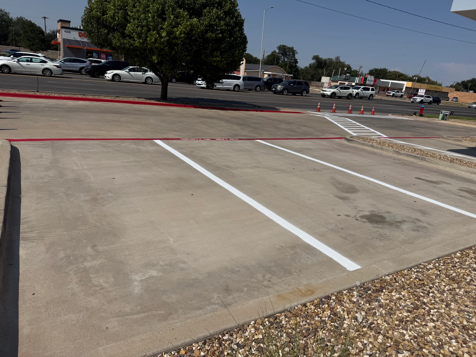 After striping · Parking stalls beside the landscaped corner