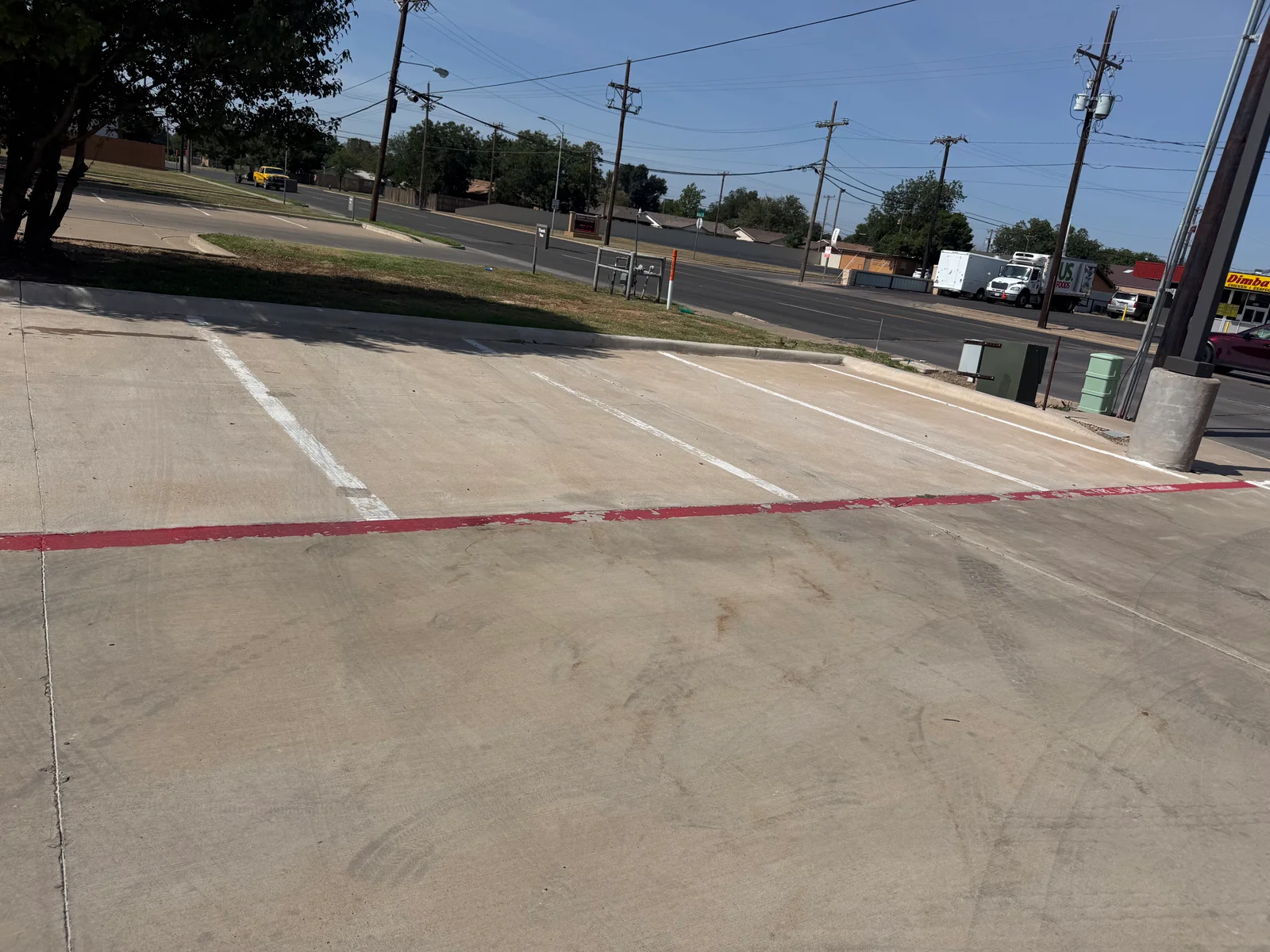 Before · Parking stalls beside the landscaped corner