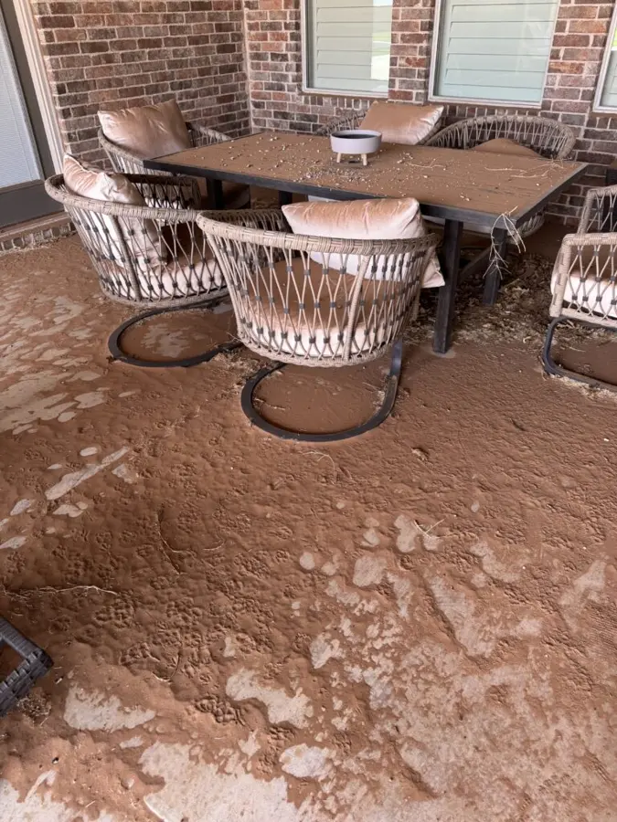Before: patio covered in mud