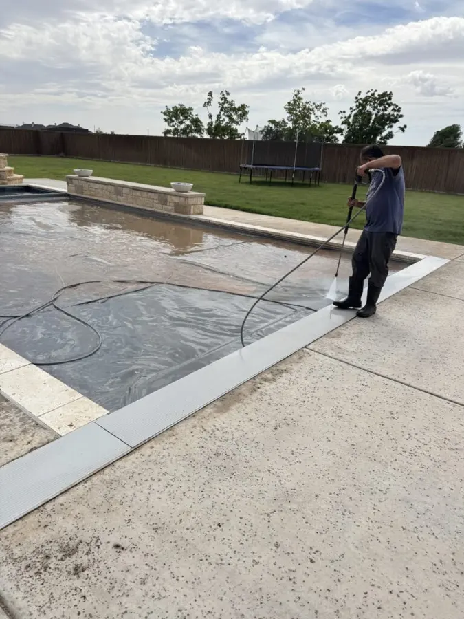 During: pool deck being washed