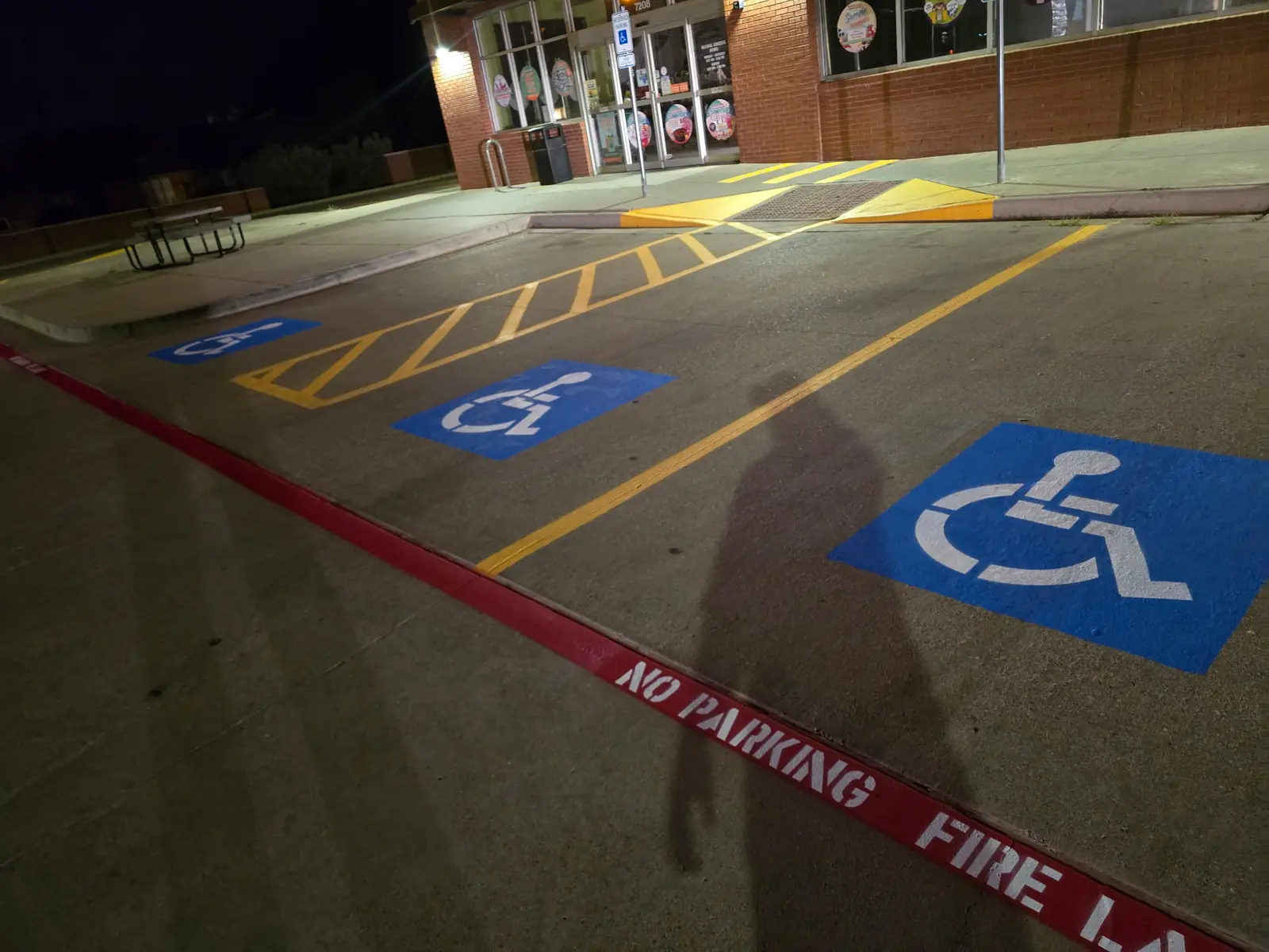 Accessible parking spaces with an access aisle and a red fire lane