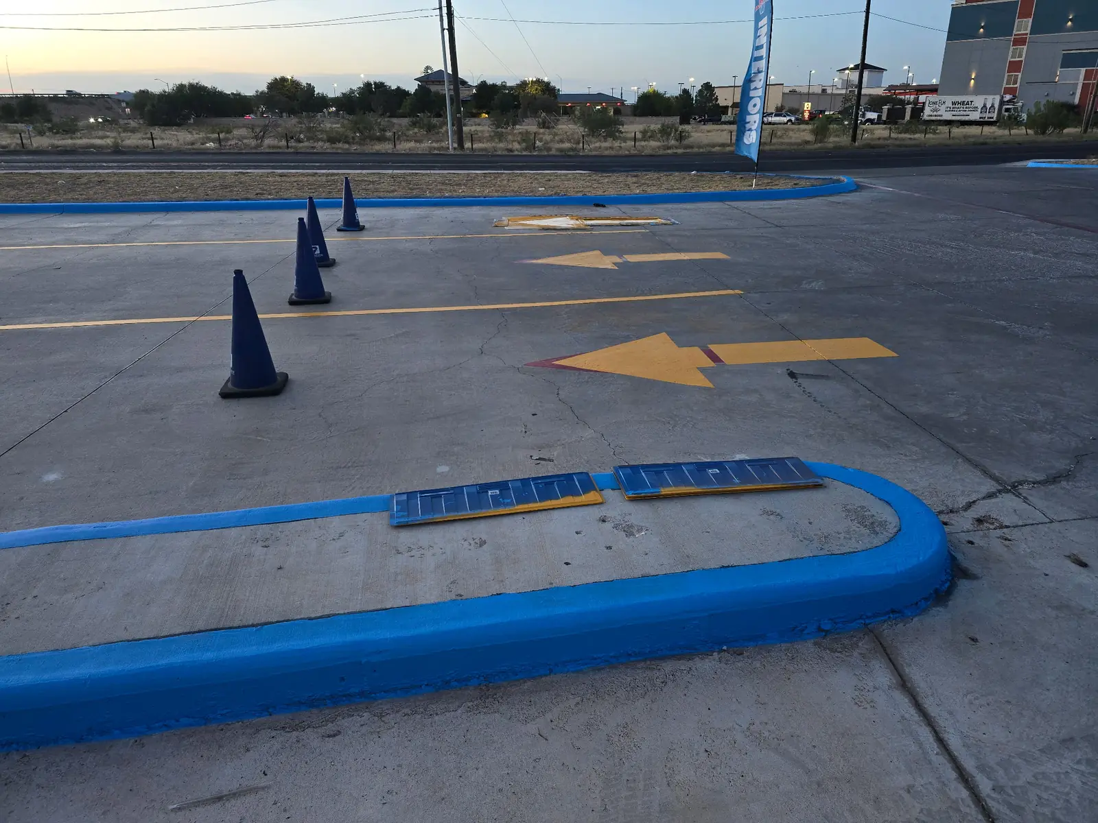 New directional arrows and a freshly painted blue curb
