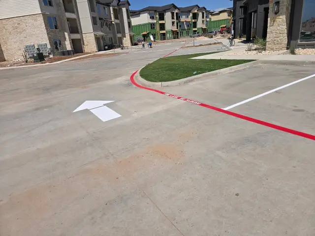 Directional arrow and curved fire lane