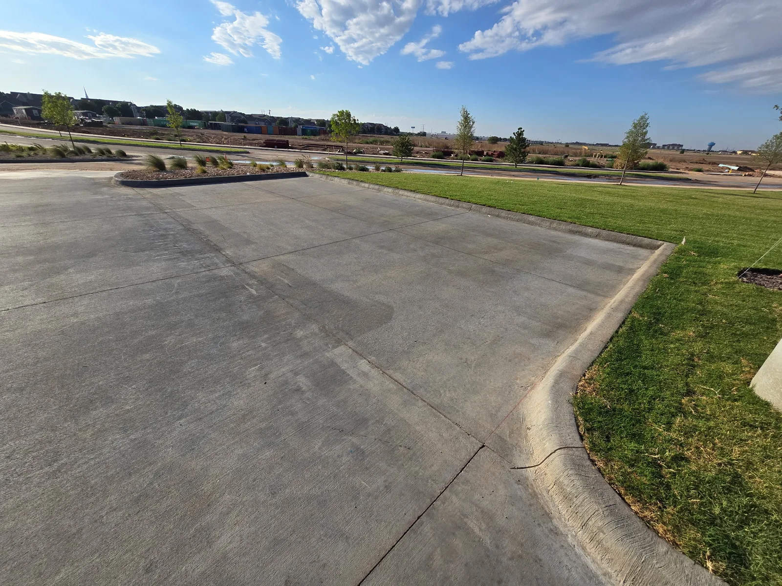 Washed: clean concrete pad, curb and new lawn